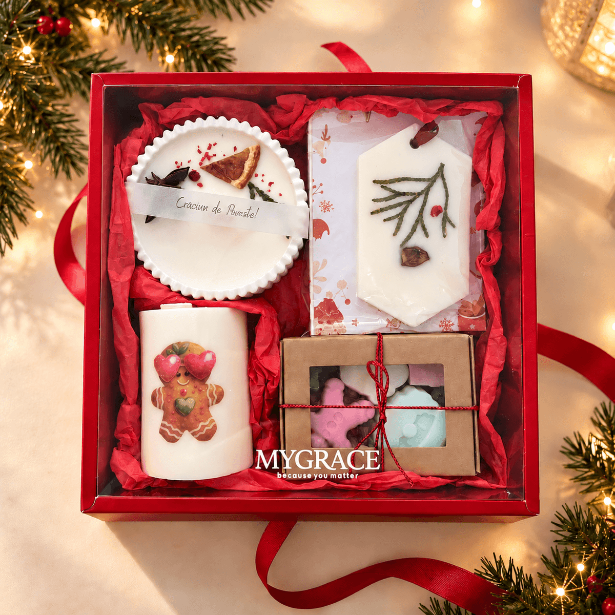 Set cadou de Crăciun MYGRACE în cutie roșie elegantă, cu lumânări decorative și produse parfumate artizanale.